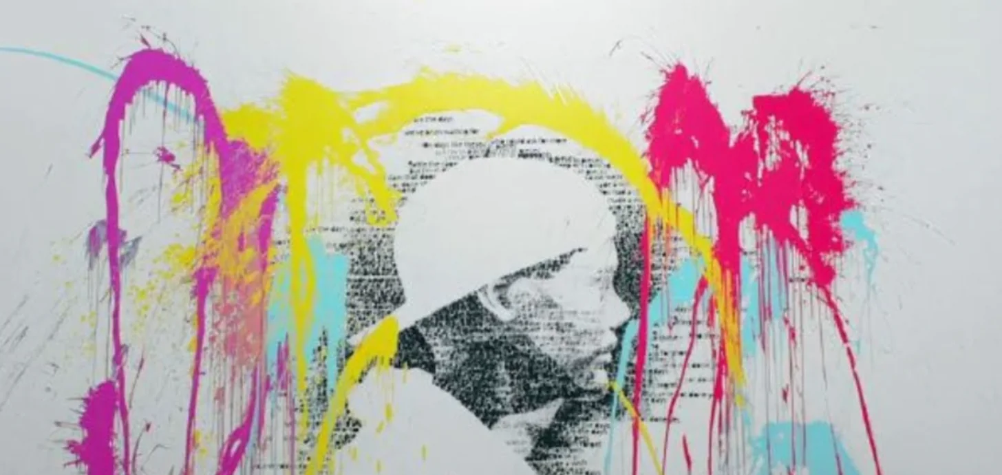 The lyric portrait of Avicii splashed with magenta, yellow and cyan paint